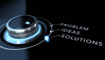 Solution switch positioned on the word solutions over black and blue background. Concept of problem solving.